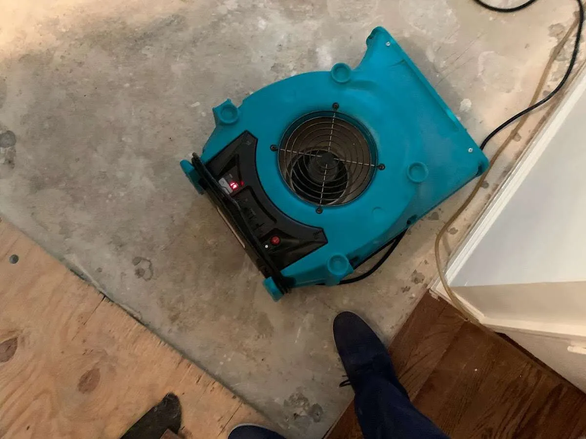 Air mover drying subfloor during Leak Detection & Repair in Coconut Creek